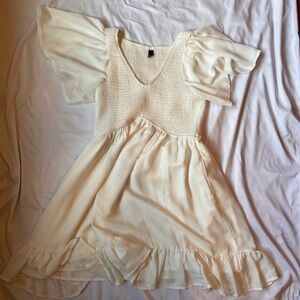 Ivory dress with flowing sleeves
